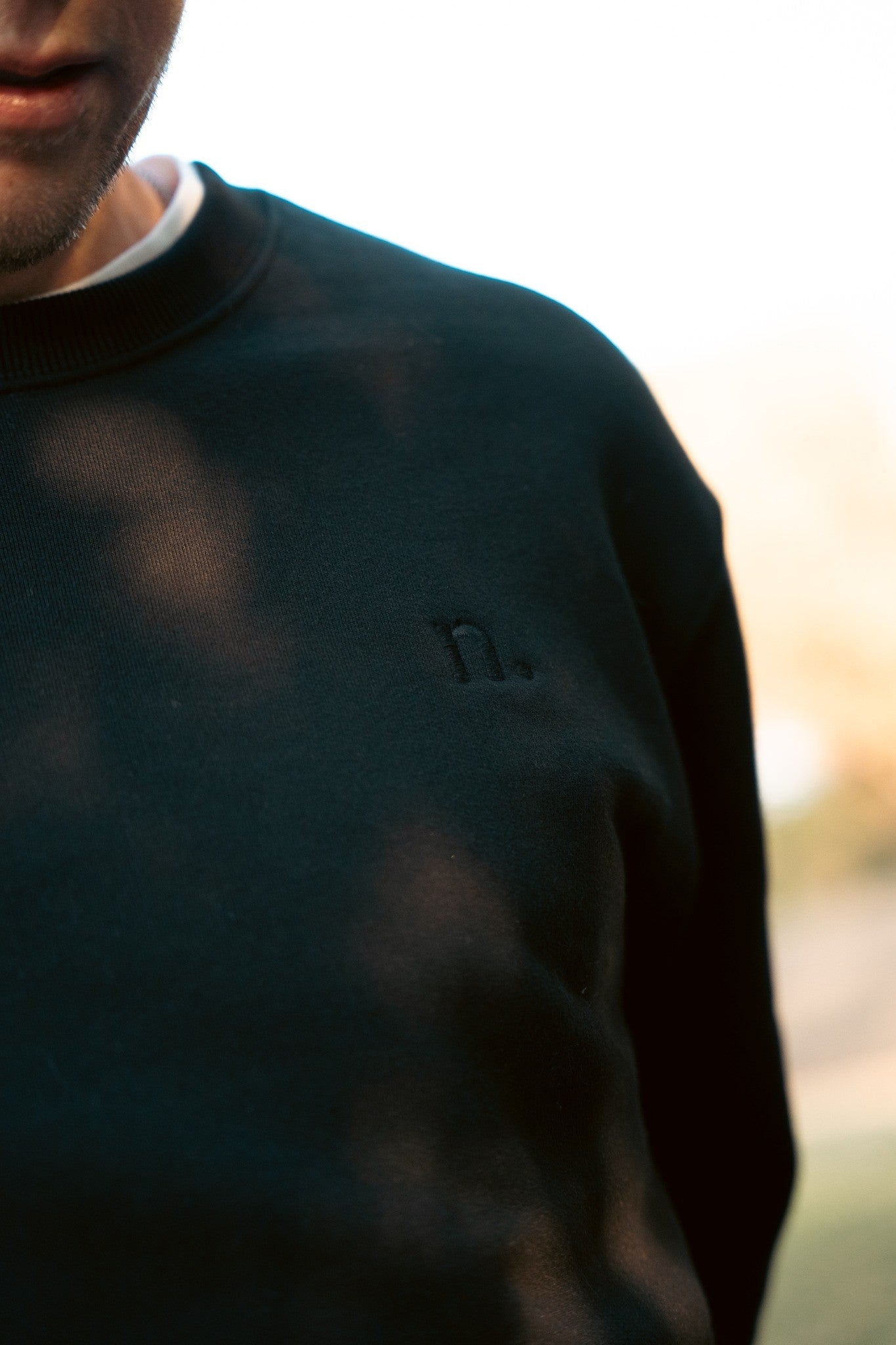 the unisex blackout crew sweater.