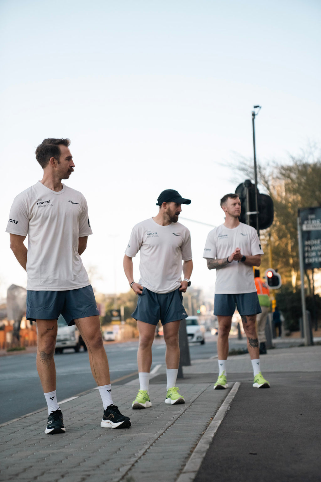 the OG beige male community tee.