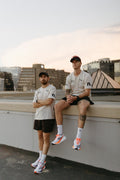 the OG beige male community tee.