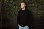 the unisex blackout crew-neck sweater.