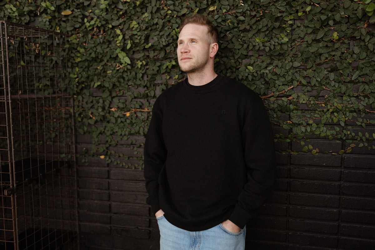 the unisex blackout crew-neck sweater.
