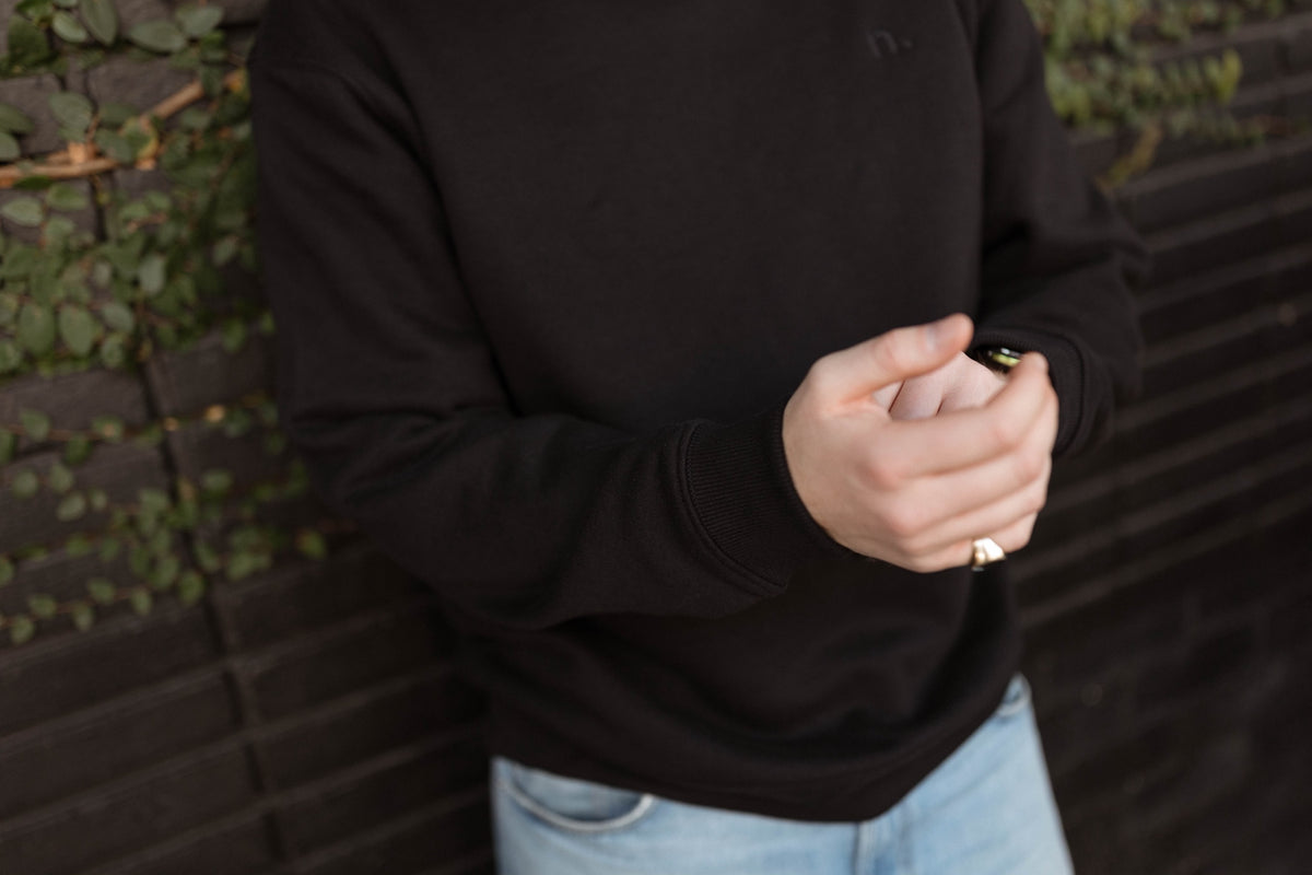 the unisex blackout crew-neck sweater.