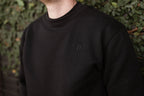 the unisex blackout crew-neck sweater.