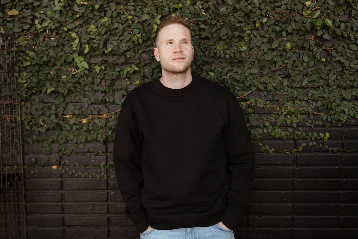 the unisex blackout crew-neck sweater.