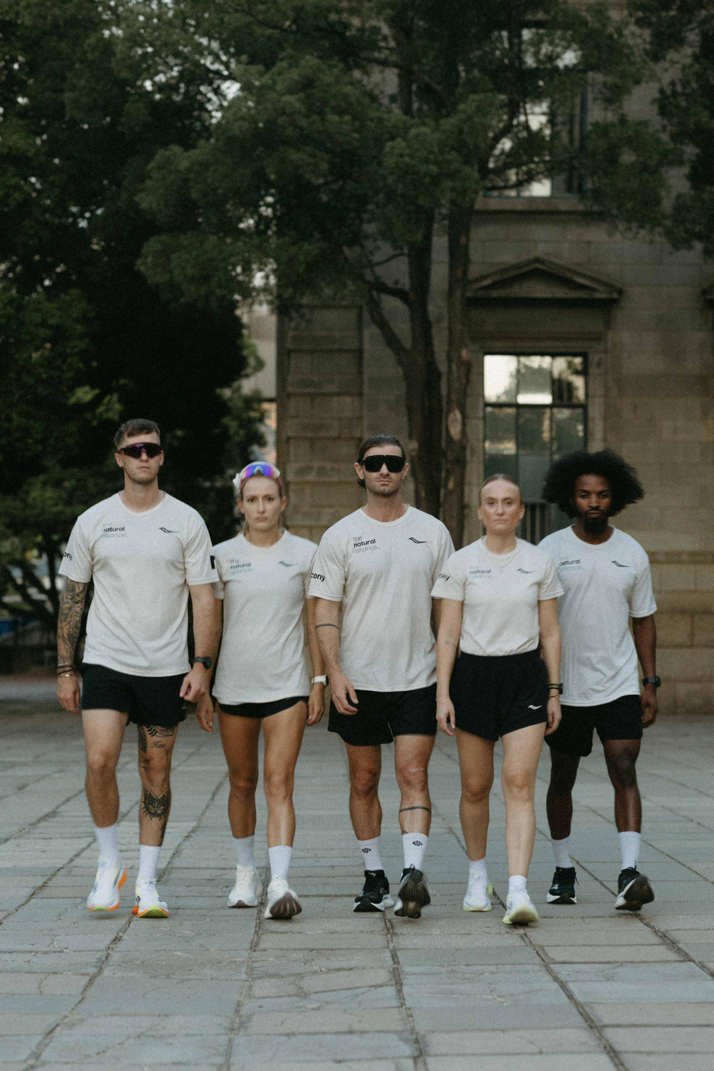 the OG beige male community tee.