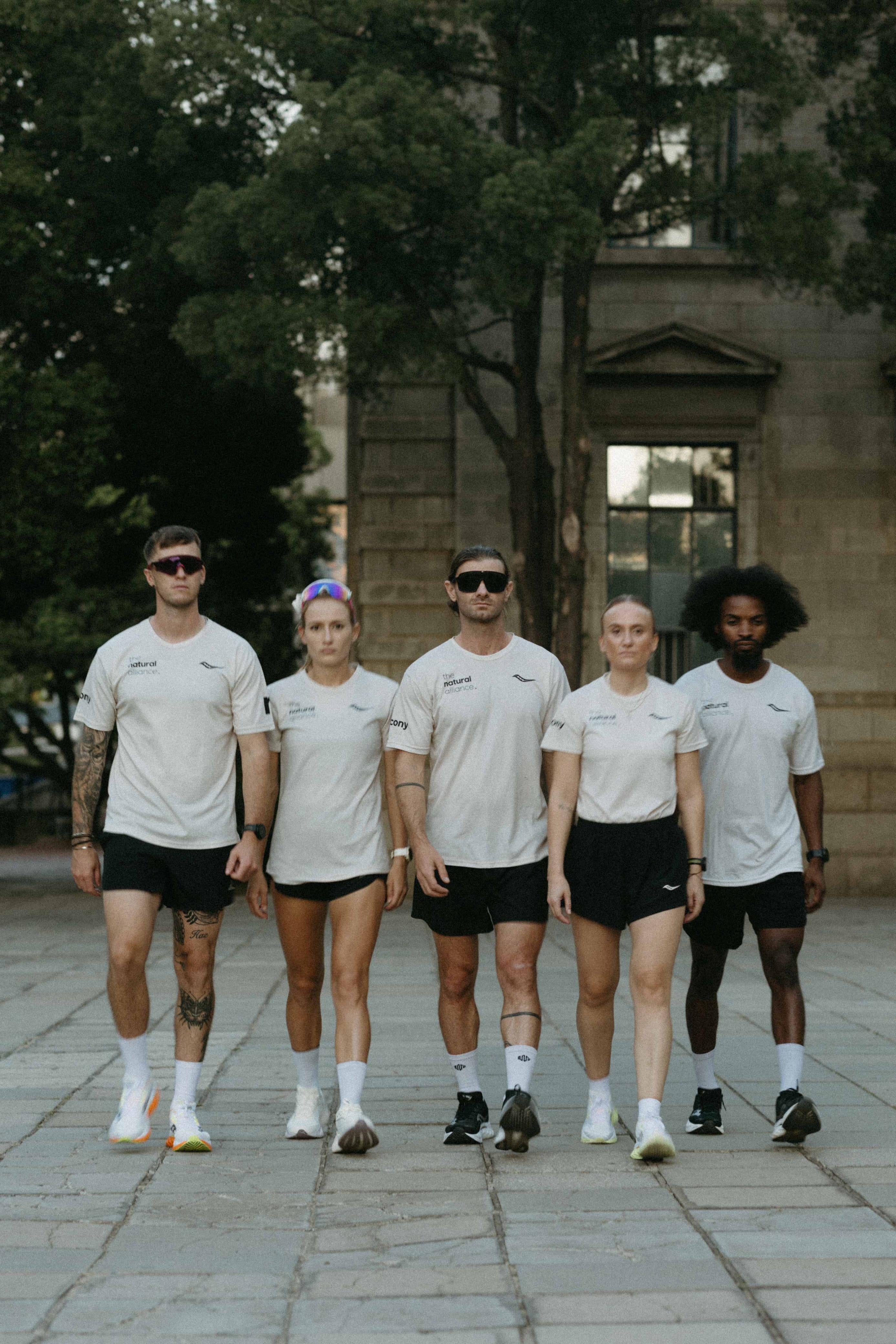 the OG beige male community tee.